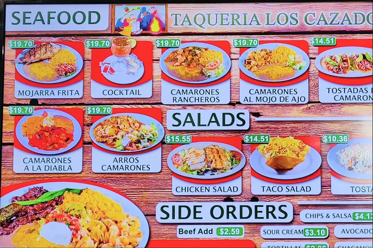 Taqueria Los Cazadores menu board — Seafood, Salads & Side Orders
